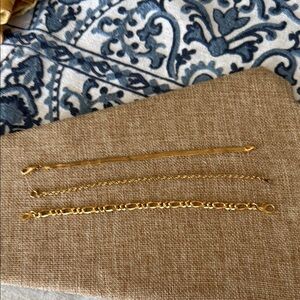 Three high gold plated different styles of chain bracelets wear all together